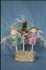 3 different scarecrows on sticks